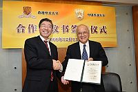 Prof. Samuel Sun of the Chinese University of Hong Kong (right) and Prof. Li Ling of the China Agricultural University, sign an agreement on collaboration between the State Key Laboratory of Agrobiotechnology of the two universities
